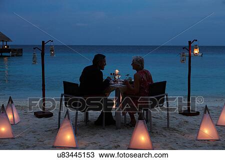 Senior Couple Enjoying Late Meal In Outdoor Restaurant View Large Photo Image Stock Image - Senior Couple Enjoying Late Meal In Outdoor Restaurant. Fotosearch
