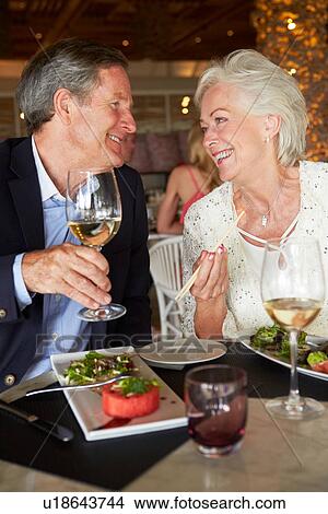 Senior Couple Enjoying Meal In Restaurant View Large Photo Image Picture - Senior Couple Enjoying Meal In Restaurant. Fotosearch