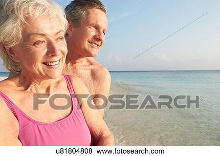Senior Couple On Tropical Beach Holiday View Large Photo Image Stock Photo - Senior Couple On Tropical Beach Holiday. Fotosearch