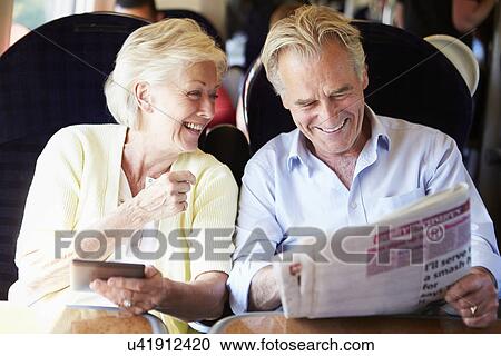 Senior Couple Relaxing On Train Journey View Large Photo Image Stock Image - Senior Couple Relaxing On Train Journey. Fotosearch