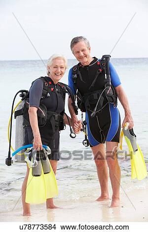 Picture - Senior Couple With Scuba Diving Equipment Enjoying Holiday. Fotosearch