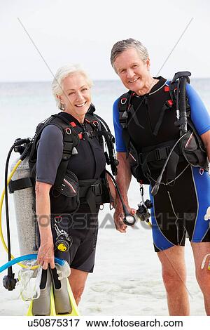 Senior Couple With Scuba Diving Equipment Enjoying Holiday View Large Photo Image Stock Photo - Senior Couple With Scuba Diving Equipment Enjoying Holiday. Fotosearch