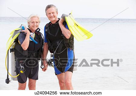 Senior Couple With Scuba Diving Equipment Enjoying Holiday View Large Photo Image Stock Photograph - Senior Couple With Scuba Diving Equipment Enjoying Holiday. Fotosearch