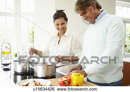 Senior Indian Couple Cooking Meal At Home View Large Photo Image Stock Photograph - Senior Indian Couple Cooking Meal At Home. Fotosearch
