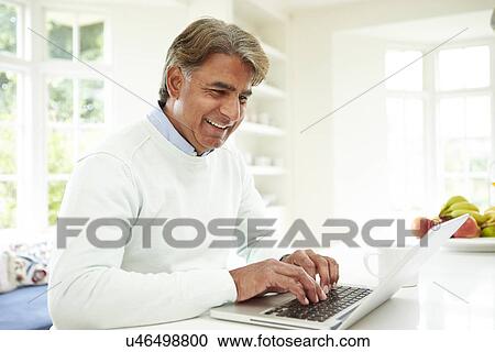 Senior Indian Man Using Laptop At Home View Large Photo Image Stock Image - Senior Indian Man Using Laptop At Home. Fotosearch