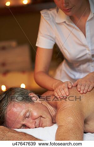 Senior Man Having Massage In Spa View Large Photo Image Stock Photo - Senior Man Having Massage In Spa. Fotosearch