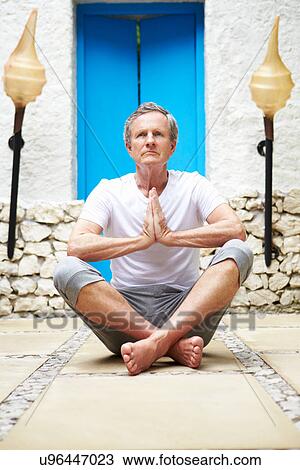 Senior Man Meditating Outdoors At Health Spa View Large Photo Image Stock Image - Senior Man Meditating Outdoors At Health Spa. Fotosearch
