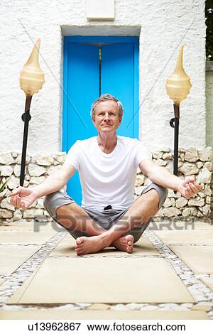 Senior Man Meditating Outdoors At Health Spa View Large Photo Image Stock Photo - Senior Man Meditating Outdoors At Health Spa. Fotosearch