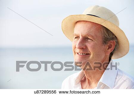 Stock Photograph - Senior Man On Tropical Beach Holiday. Fotosearch