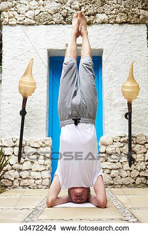 Senior Man Standing On Head In Yoga Position View Large Photo Image Picture - Senior Man Standing On Head In Yoga Position. Fotosearch