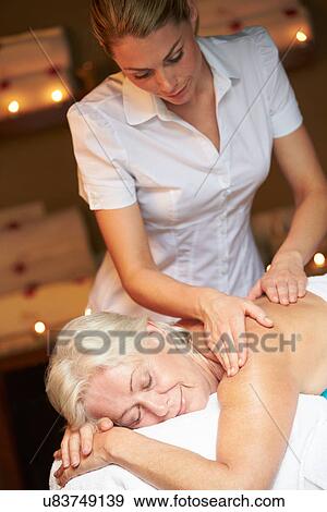 Senior Woman Having Massage In Spa View Large Photo Image Stock Photo - Senior Woman Having Massage In Spa. Fotosearch