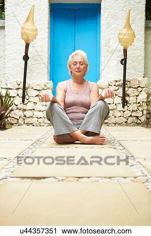 Senior Woman Meditating Outdoors At Health Spa View Large Photo Image Stock Image - Senior Woman Meditating Outdoors At Health Spa. Fotosearch