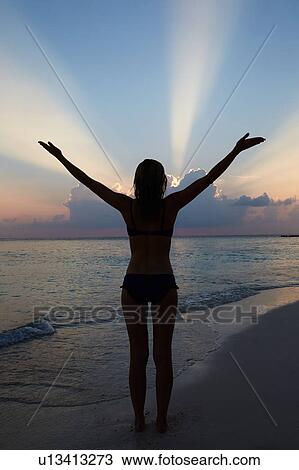 Silhouette Of Woman With Outstretched Arms On Beach View Large Photo Image Stock Image - Silhouette Of Woman With Outstretched Arms On Beach . Fotosearch