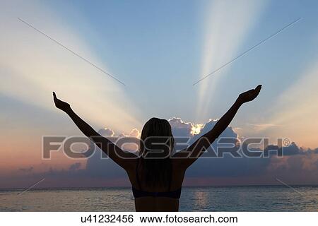 Silhouette Of Woman With Outstretched Arms On Beach View Large Photo Image Stock Photograph - Silhouette Of Woman With Outstretched Arms On Beach . Fotosearch