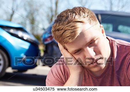 Stressed Driver Sitting At Roadside After Traffic Accident View Large Photo Image Stock Photography - Stressed Driver Sitting At Roadside After Traffic Accident. Fotosearch