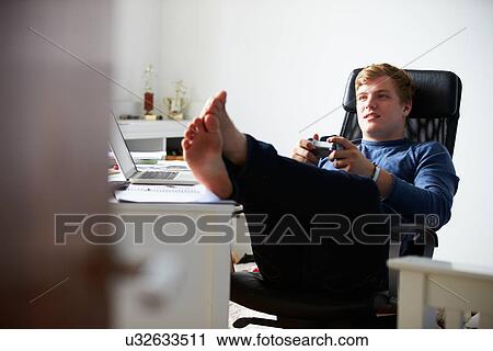 Teenage Boy Playing Video Game In Bedroom View Large Photo Image Stock Image - Teenage Boy Playing Video Game In Bedroom. Fotosearch