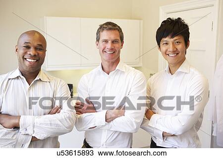 Three Doctors Having Discussion Using Digital Tablet View Large Photo Image Stock Image - Three Doctors Having Discussion Using Digital Tablet. Fotosearch
