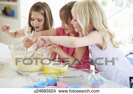 Three Girls Making Cupcakes In Kitchen View Large Photo Image Picture - Three Girls Making Cupcakes In Kitchen. Fotosearch