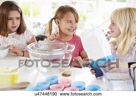 Three Girls Making Cupcakes In Kitchen View Large Photo Image Stock Image - Three Girls Making Cupcakes In Kitchen. Fotosearch