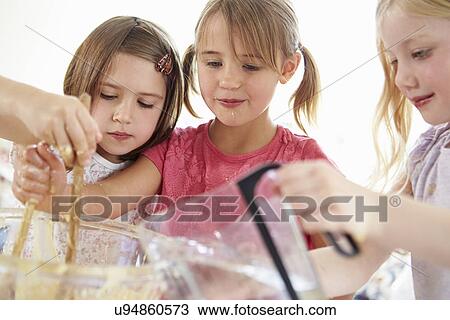 Three Girls Making Cupcakes In Kitchen View Large Photo Image Stock Image - Three Girls Making Cupcakes In Kitchen. Fotosearch