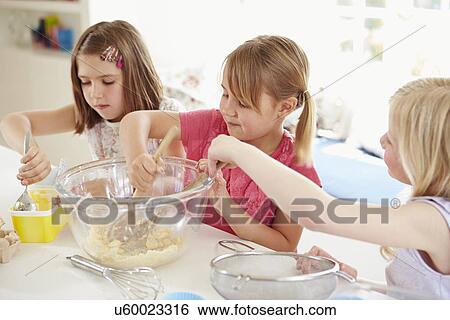 Three Girls Making Cupcakes In Kitchen View Large Photo Image Stock Photograph - Three Girls Making Cupcakes In Kitchen. Fotosearch