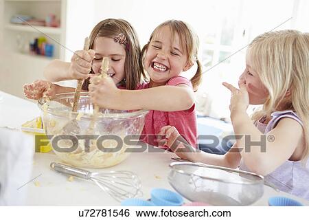 Three Girls Making Cupcakes In Kitchen View Large Photo Image Stock Photograph - Three Girls Making Cupcakes In Kitchen. Fotosearch