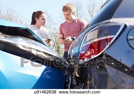 Two Drivers Exchange Insurance Details After Accident View Large Photo Image Stock Photo - Two Drivers Exchange Insurance Details After Accident. Fotosearch
