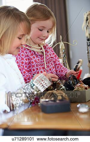Two Girls Playing With Jewelry And Make Up View Large Photo Image Stock Image - Two Girls Playing With Jewelry And Make Up. Fotosearch