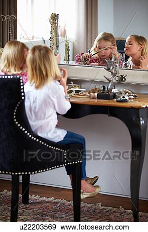 Two Girls Playing With Jewelry And Make Up View Large Photo Image Stock Photo - Two Girls Playing With Jewelry And Make Up. Fotosearch