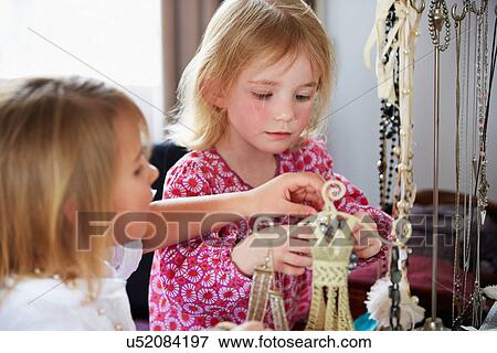 Two Girls Playing With Jewelry And Make Up View Large Photo Image Stock Photo - Two Girls Playing With Jewelry And Make Up. Fotosearch