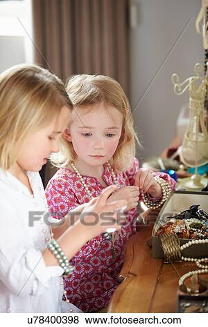 Two Girls Playing With Jewelry And Make Up View Large Photo Image Stock Photo - Two Girls Playing With Jewelry And Make Up. Fotosearch