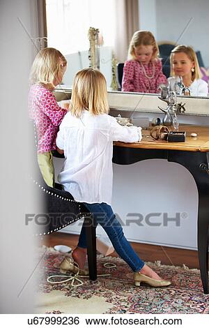 Two Girls Playing With Jewelry And Make Up View Large Photo Image Stock Photograph - Two Girls Playing With Jewelry And Make Up. Fotosearch