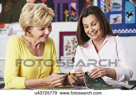 Two Women Sewing Quilt Together View Large Photo Image Stock Photo - Two Women Sewing Quilt Together. Fotosearch