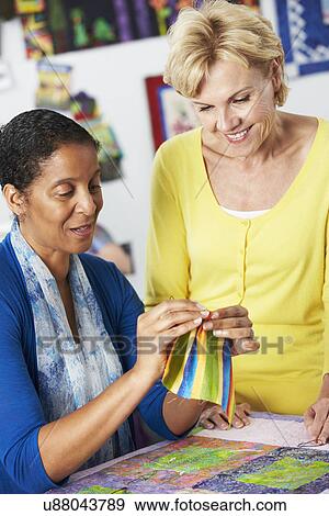 Two Women Sewing Quilt Together View Large Photo Image Stock Photo - Two Women Sewing Quilt Together. Fotosearch