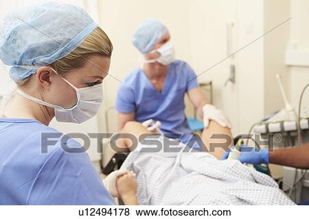 Woman Having Eggs Removed As Part Of IVF Treatment View Large Photo Image Stock Photo - Woman Having Eggs Removed As Part Of IVF Treatment. Fotosearch