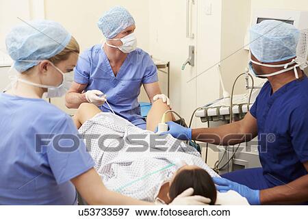 Stock Photo - Woman Having Eggs Removed As Part Of IVF Treatment. Fotosearch