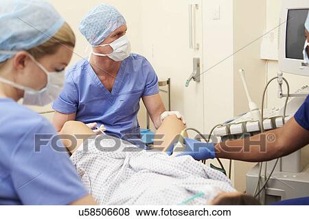 Stock Photo - Woman Having Eggs Removed As Part Of IVF Treatment. Fotosearch