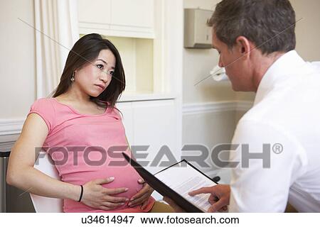 Woman Meeting With Obstetrician In Clinic View Large Photo Image Stock Photo - Woman Meeting With Obstetrician In Clinic. Fotosearch
