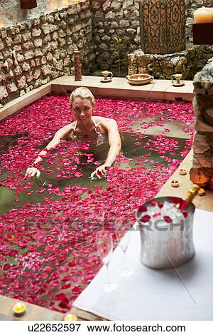 Woman Relaxing In Flower Petal Covered Pool At Spa View Large Photo Image Stock Photo - Woman Relaxing In Flower Petal Covered Pool At Spa. Fotosearch