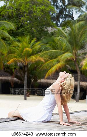 Woman Sitting On Wooden Jetty View Large Photo Image Stock Image - Woman Sitting On Wooden Jetty. Fotosearch