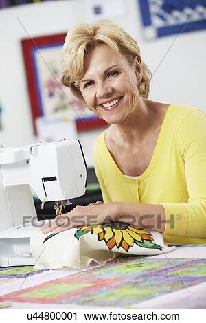Woman Using Electric Sewing Machine View Large Photo Image Stock Image - Woman Using Electric Sewing Machine. Fotosearch