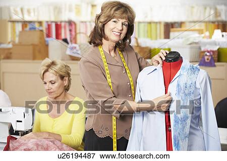 Stock Photo - Women In Dress Making Class. Fotosearch
