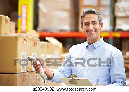 Worker Scanning Package In Warehouse View Large Photo Image Stock Image - Worker Scanning Package In Warehouse. Fotosearch