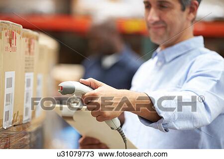 Worker Scanning Package In Warehouse View Large Photo Image Stock Image - Worker Scanning Package In Warehouse. Fotosearch