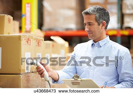 Worker Scanning Package In Warehouse View Large Photo Image Stock Image - Worker Scanning Package In Warehouse. Fotosearch