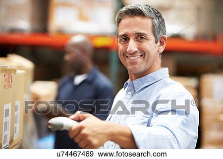 Worker Scanning Package In Warehouse View Large Photo Image Stock Photo - Worker Scanning Package In Warehouse. Fotosearch