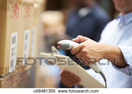 Worker Scanning Package In Warehouse View Large Photo Image Stock Photography - Worker Scanning Package In Warehouse. Fotosearch