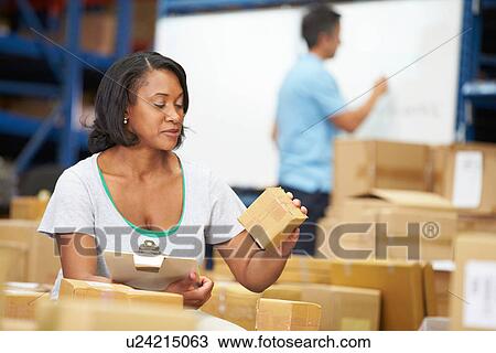 Workers In Warehouse Preparing Goods For Dispatch View Large Photo Image Stock Image - Workers In Warehouse Preparing Goods For Dispatch. Fotosearch