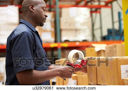 Workers In Warehouse Preparing Goods For Dispatch View Large Photo Image Stock Image - Workers In Warehouse Preparing Goods For Dispatch. Fotosearch