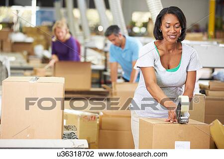 Workers In Warehouse Preparing Goods For Dispatch View Large Photo Image Stock Image - Workers In Warehouse Preparing Goods For Dispatch. Fotosearch